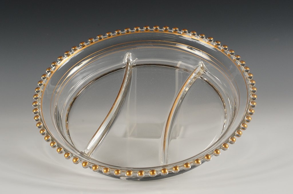 IMPERIAL CANDLEWICK 22KT GOLD DECORATED RELISH: 400/56, divided relish decorated with 22 kt gold accents by Glastonbury, circa 1941-1943, measures 2 x 10.25 inches in diameter.