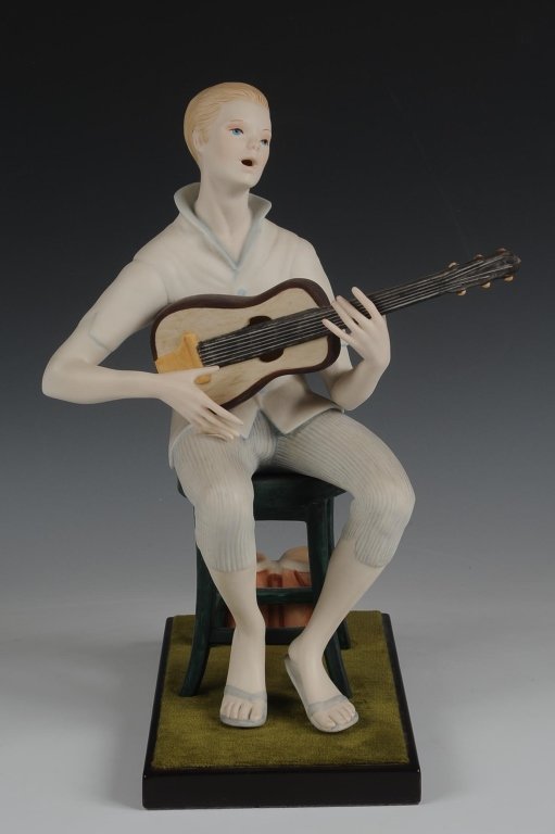 CYBIS PORCELAIN 'FOLK SINGER' FIGURE, LIMITED EDITION: Limited edition of 500, signed and numbered #128 on the back, with a felted wooden base, measures 13 inches.