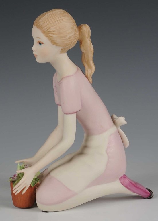 CYBIS PORCELAIN 'REBECCA WITH FLOWERS' FIGURE, RETIRED: Signed on the base, measures 6.25 inches.