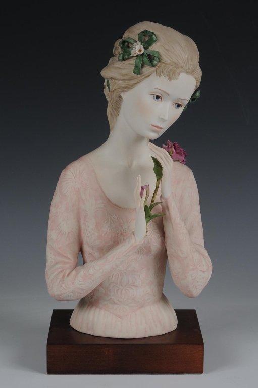 CYBIS PORCELAIN 'JULIET' BUST, LIMITED EDITION: Limited edition, signed on the back, numbered #588, green ribbon in her hair and open rose bud, with a wooden base, measures 12 inches.