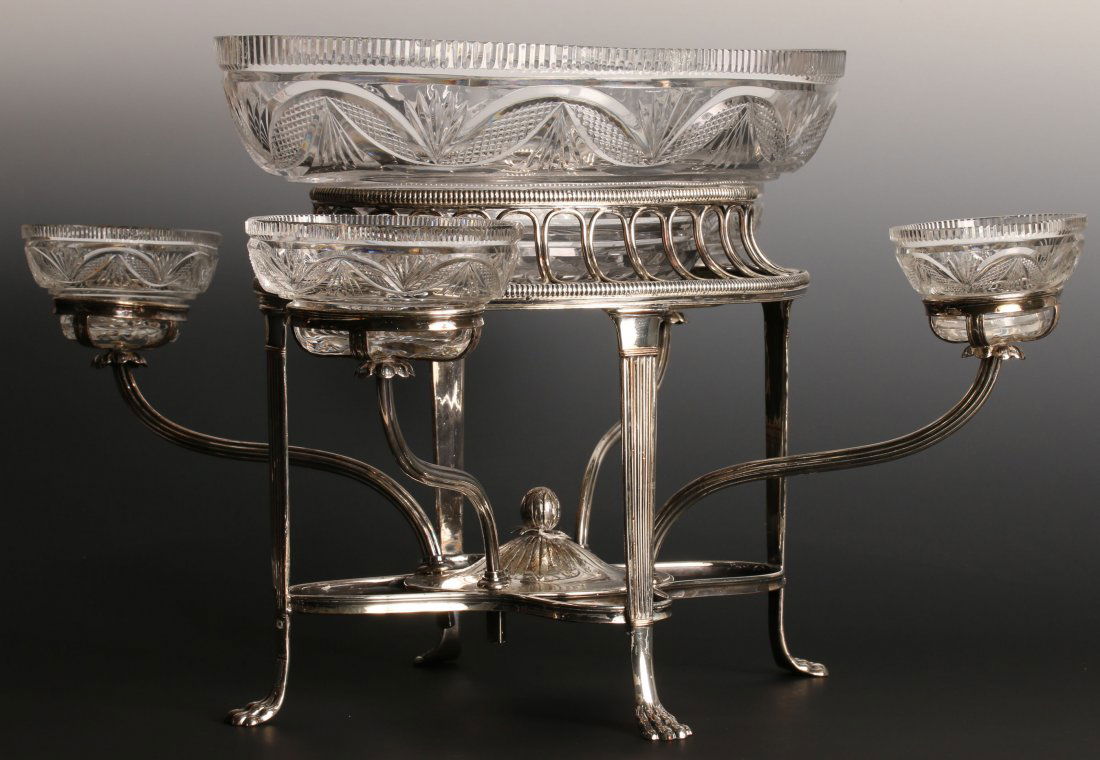ENGLISH OLD SHEFFIELD PLATE EPERGNE WITH CUT CRYSTAL: Large oval cut crystal center bowl and four small cut glass bowls on removable arms, claw feet, openwork loops, includes an extra side bowl, measures 12.5 x 15.5 x 15.5 inches.