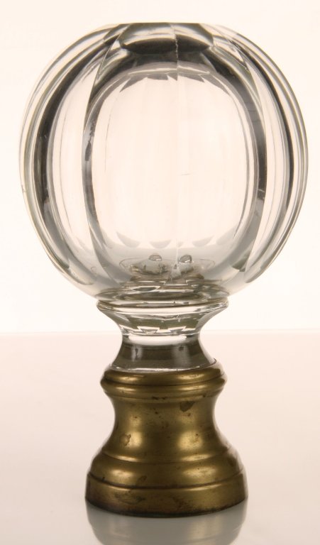 CRYSTAL NEWEL POST FINIAL: Cut and polished glass with brass newel post mount. Measures 6.5 x 3.75 inches.