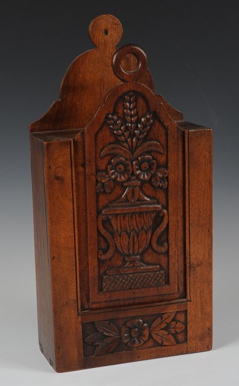 EARLY 19TH C FRENCH PROVINCIAL CARVED WOOD BOX: A wall hanging box with sliding front and dovetailed construction. Nice relief carving and great patina to the French walnut. Measures 17.75 x 8.5 inches.