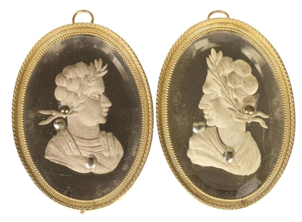 PAIR OF 18TH CENTURY INTAGLIO PORTRAITS: Intaglio portraits under beveled glass, gilded frame, measure 3.5 x 2.25 inches each.