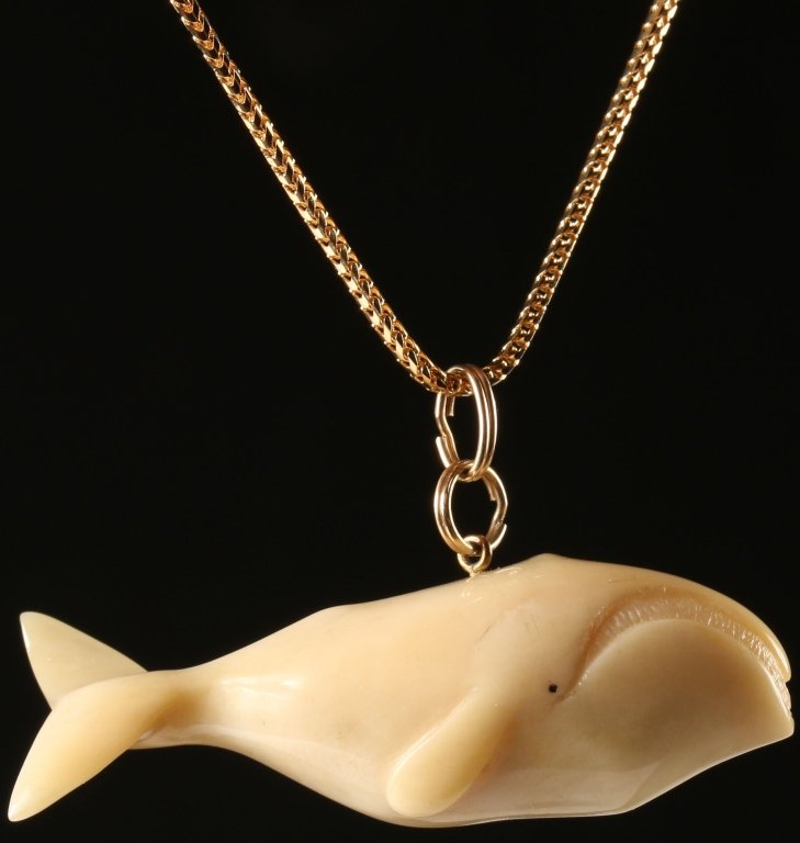 MARINE IVORY WHALE PENDANT ON 14K GOLD CHAIN: A 22 inch 2mm Franco link chain is 14k and weighs 8 grams.