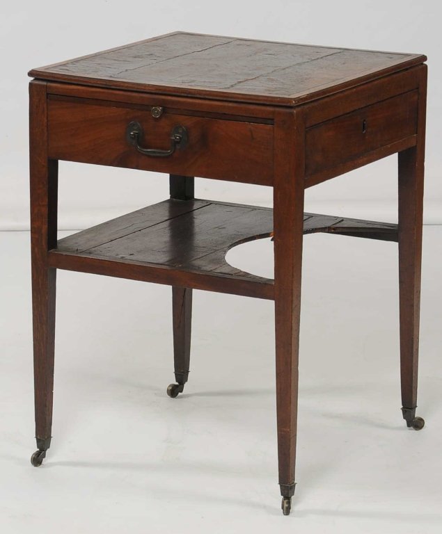 19TH C. MAHOGANY ARCHITECT'S TABLE: Old original leather inset top, slide out side shelves and front drawer. Measures 29.5 x 21.5 x 21.5 inches.