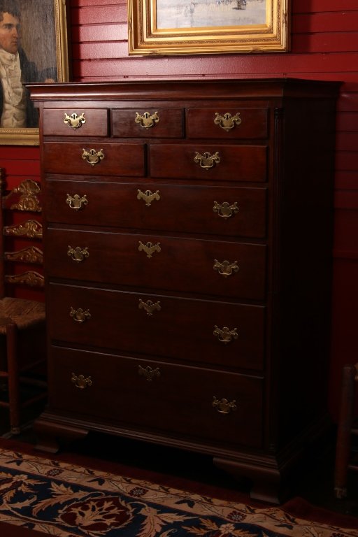 19TH CENTURY AMERICAN CHIPPENDALE MAHOGANY TALL CHEST: With molded cornice top, 1/4 columns, nine drawers and bracket feet. The brasses fit the original holes and appear old. The cabinet of this piece has been cut completely in half and can be separated i