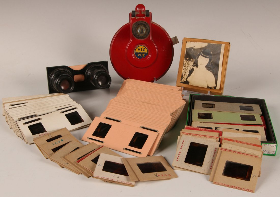 VINTAGE PIN-UP GIRL SLIDES AND VIEWERS COLLECTION: Sterio viewer with 87 slides, a Viz-Vue viewer with a pin-up girl reel, 36 single pin-up slides and a Betty Page movie reel.