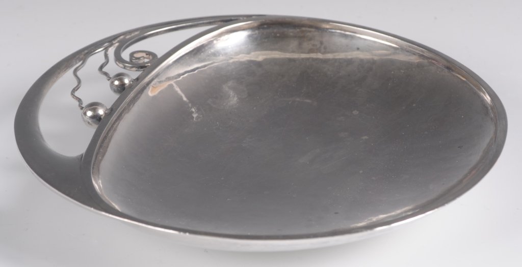 HANS HANSEN ART DECO HAMMERED STERLING SILVER: A hand hammered dish with applied wire designs. Measures 1 inch deep with a 6.25 inch diameter. Weighs 7.15 oz. troy. We ship in-house for all but very large and or very fragile items and some interna