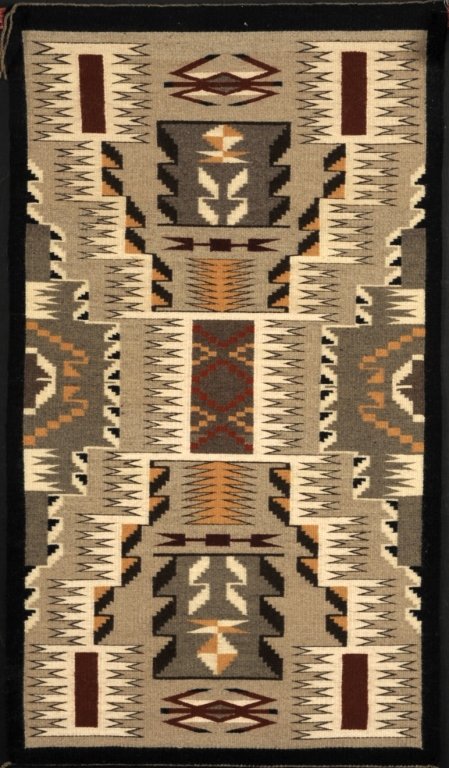 STORM PATTERN NAVAJO WEAVING ATTRIB TO BLANCHE WILSON: A tapestry weave storm-pattern rug attributed to Blanche Wilson of Dinnebito, AZ. A tag dated 1991 makes the attribution and states that the hand-spun wool came from the weaver's own sheep. Tapestry w