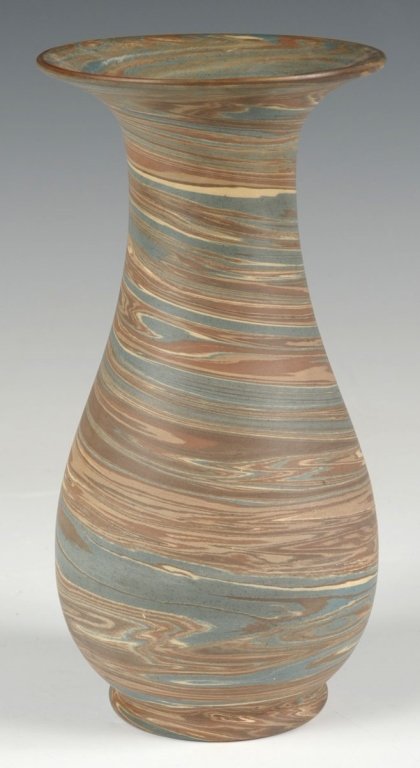 NILOAK MISSION WARE ART POTTERY VASE: A waisted form vase with impressed mark under the base. Measures 8 inches. We ship in-house for all but very large and or very fragile items and some international shipments.