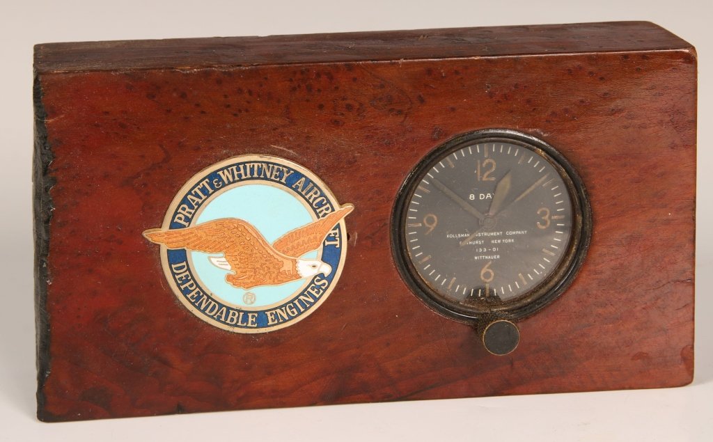 UNIQUE MOUNTED WWII EIGHT DAY WITTTNAUER AIRCRAFT CLOCK: Heavy burl wood block drilled and fitted with WWII eight day Wittnauer aircraft clock, winding stem on front, nice condition but not functioning as of writing. Block has been mounted with a brass and