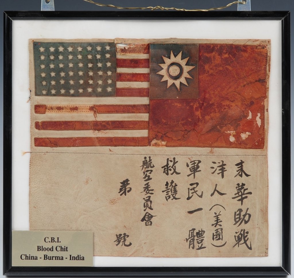 THEATER MADE WWII ARMY AIRFORCE LEATHER BLOOD CHIT: Standard pattern featuring both US and Chinese flags at top, white panel below is marked with Chinese characters indicating anyone who assists the aviator will be rewarded for his safe return. Has bee