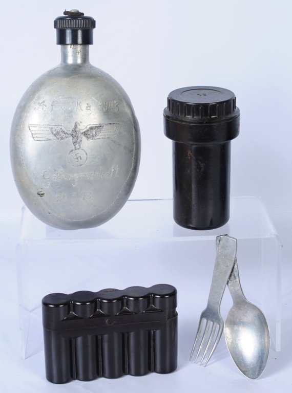 HISTORIC GERMAN POW TRENCH ART CANTEEN AND MORE: 1941 dated aluminum German canteen has been artfully hand engraved 'Africa 1943' with large Nazi eagle, spread wing above swastika, inscribed below and dated 1943. Has brown Bakelite top, maker marked