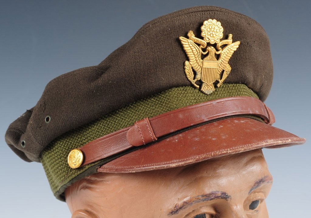 WWII AAF 'FLIGHTER' OFFICERS CRUSH CAP: Soft brown gabardine top with olive green woven band, large gilt eagle device with side buttons. Soft leather bill and chin strap. Bancroft flighter marked on sweatband, needs shaping. Some moth nips