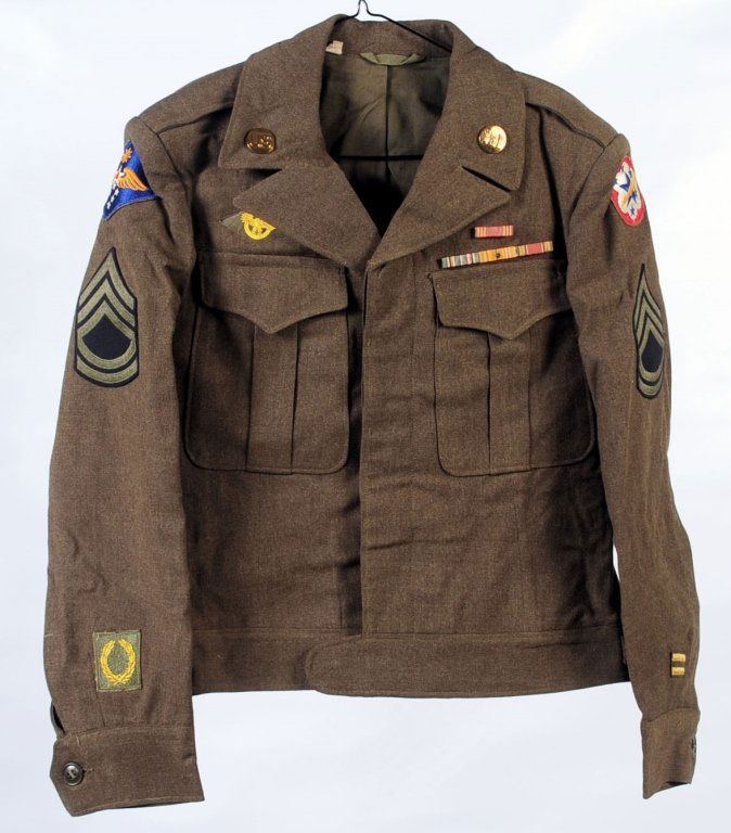 WWII ARMY AIR FORCE ENGINEERS UNIFORM GROUPING: Lot consists of WWII Army Air Force issue type B4 bag that still contains the uniforms as brought home from service. Numerous pieces to include a brown leather garrison Belt with open face brass buckl