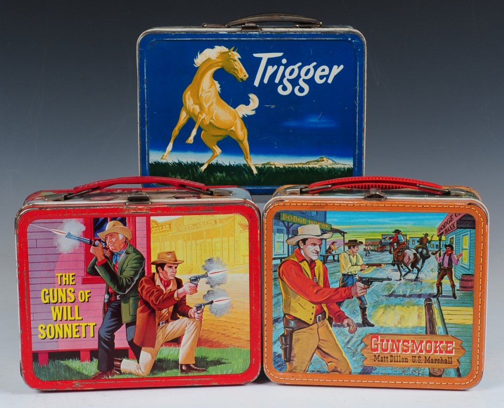 THREE WESTERN TV SHOW THEMED LUNCH BOXES: Includes Trigger(1957) a Roy Rogers spin-off box, The Guns of Will Sonnett(1968) and Gunsmoke(1959).