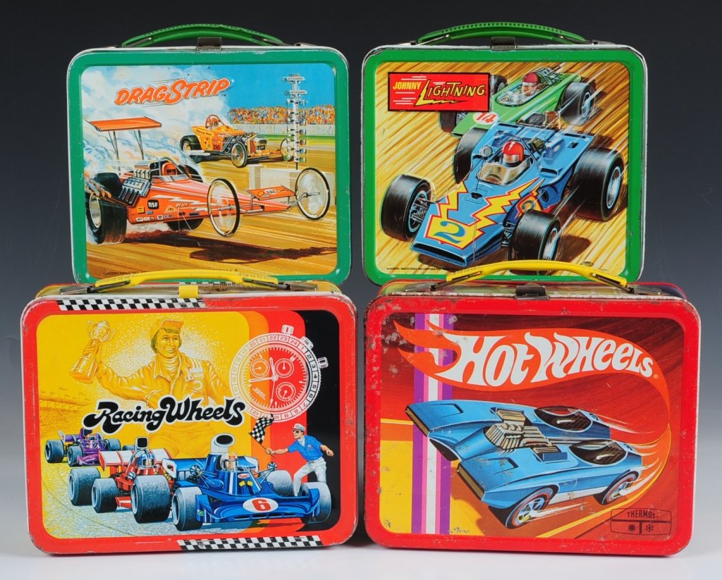 1969 HOT WHEELS PLUS THREE OTHER CAR-RELATED: LUNCH BOXES. Hot Wheels(1969) with matching tin-litho thermos plus Racing Wheels(1977), Johnny Lightning(1970) and Drag Strip(1975) all with matching plastic thermoses.
