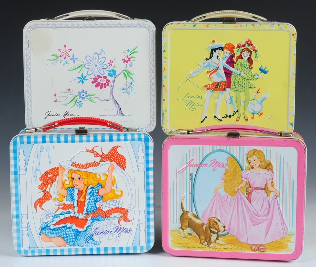 FOUR JUNIOR MISS LUNCH BOXES: Floral(1956-1963) including matching tin-litho thermos, Three Girls and a Duck(1970), Big Hat(1973) with matching plastic thermos and Basset Hound(1978) with matching plastic thermos.