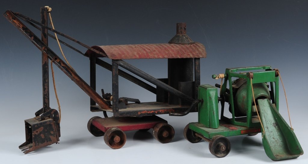 TWO CIRCA 1920 BUDDY L PRESSED STEEL TOYS: Steam shovel 15 x 20 inches and cement mixer 8 x 10 inches. Each in original paint, decal remains on each, good overall.