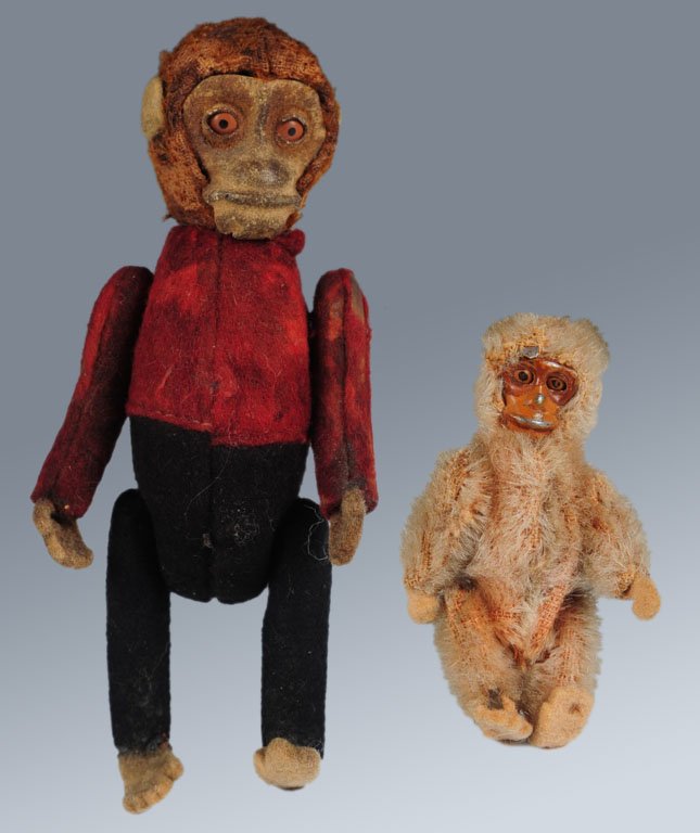 TWO SCHUCO MONKEYS: Schuco wind-up tumbling mouse, measures 4 inches, nose is worn through, felt paws are missing from the arms, felt worn away on the back, winds and runs freely, key is present. Plus a mohair jointed te