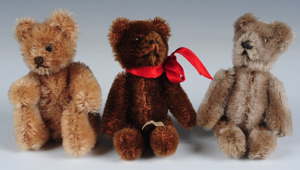 THREE MINIATURE JOINTED TEDDY BEARS: Vintage and modern mohair miniature stuffed animals, unmarked, measure from 2.25 to 3.5 inches.