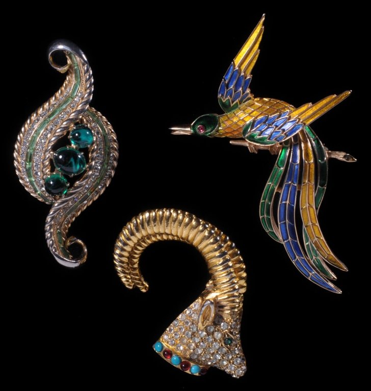 VINTAGE ENAMELED AND JEWELED COSTUME JEWELRY PINS: Richelieu, Trifari and Schiaparelli brooches, all are signed on the back, measure 2 to 4 inches.
