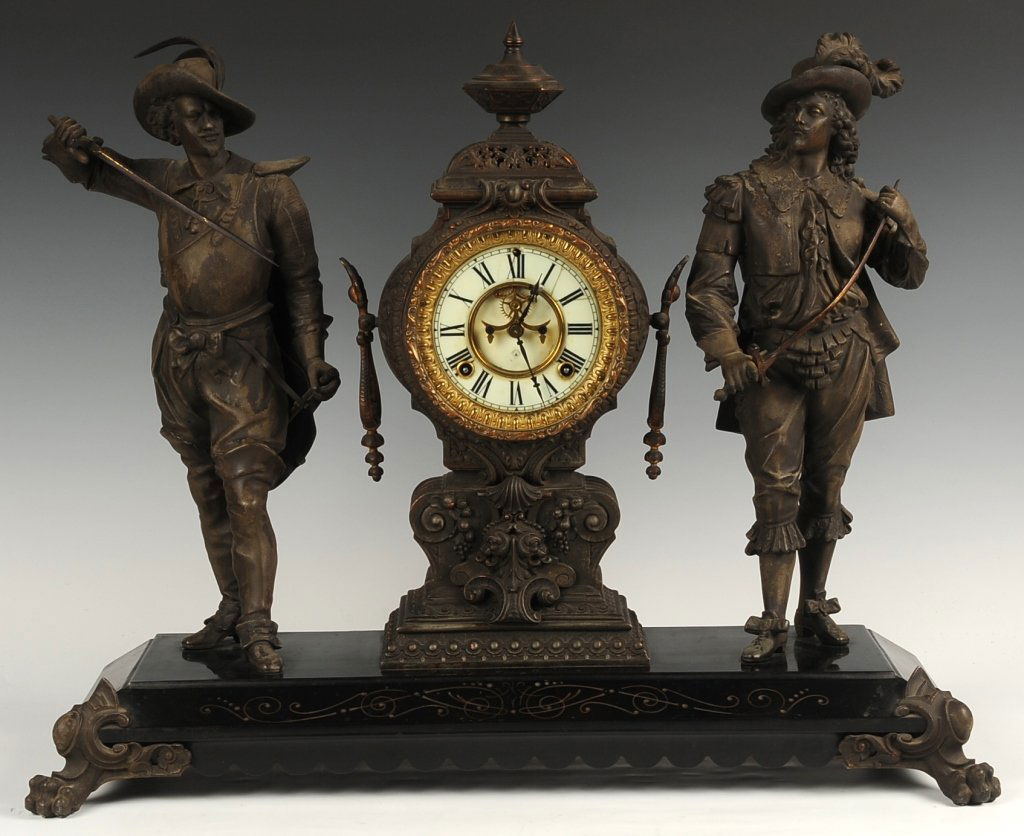 ANSONIA DON JUAN & DON CAESAR DOUBLE STATUE CLOCK: Double sunk dial, exposed escapement, time and strike movement, porcelain enamel dial, key present, measures 21 x 25.5 x 9 inches. ?We are happy to offer in-house shipping for all but very large or ve