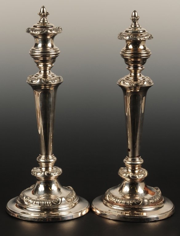 PAIR OF OLD SHEFFIELD PLATE CANDLESTICKS: With fitted snuffers in the candle cups and a faint engraved family crest, measures 13 inches tall on 5.75 inch diameter base. ?We are happy to offer in-house shipping for all but very large or very f