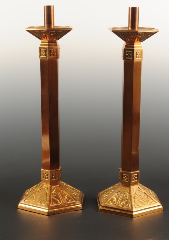 HEAVY BRASS ALTAR STICKS WITH ARTS AND CRAFTS INFLUENCE: Heavy altar sticks, each measures 20.5 x 7.5 inches. ?We are happy to offer in-house shipping for all but very large or very fragile items. Some international orders may need to be handled by a third 