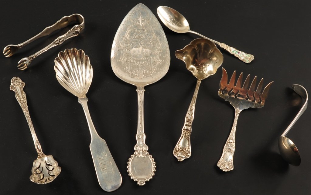 ESTATE LOT OF ORNATE STERLING SILVER SERVING UTENSILS: Eight pieces, some with monograms, sizes range from 4 to 8.75 inches, total weight 6.6 ozt. ?We are happy to offer in-house shipping for all but very large or very fragile items. Some international or