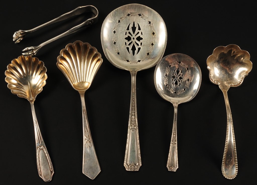 ESTATE LOT OF STERLING SILVER SERVING UTENSILS: Six pieces, one monogrammed, sizes range from 4 to 7.25 inches, total weight 5.65 ozt. ?We are happy to offer in-house shipping for all but very large or very fragile items. Some international orders 