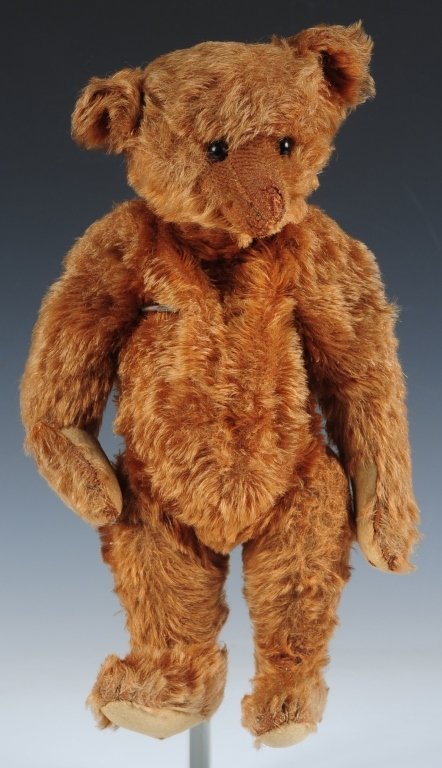 CIRCA 1920 STEIFF BEAR: Chestnut colored mohair Steiff bear, shoe button eyes, maker's button in ear, felt paw pads, measures 13 inches standing.