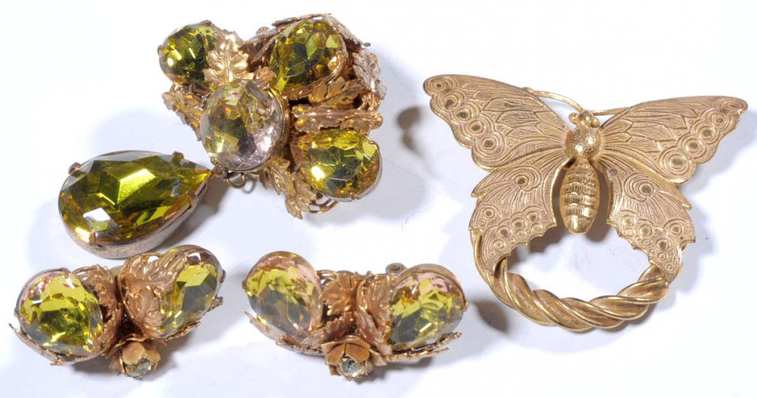 VINTAGE MIRIAM HASKELL BROOCHES AND EARRINGS: Goldtone butterfly brooch, marked on the back, measures 2 x 2.25 inches. Plus a jeweled brooch with matching clip-on earrings, all are signed on the backs, brooch measures 2.5 x 1.75 inches, earrings