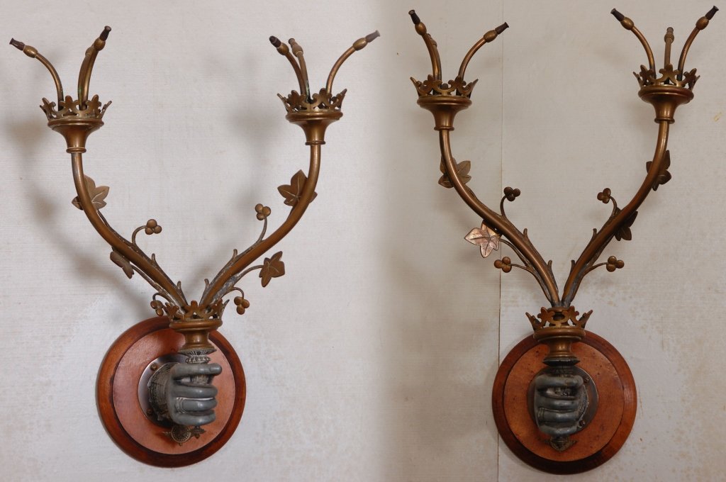 PAIR OF UNUSUAL 19TH C. FIGURAL GAS LIGHT FIXTURES: A pair of wall mount fixtures, each with a base metal figural hand holding two-arm brass branches tipped with gas jets. Circa 1840. Measure 16 x 15 inches.