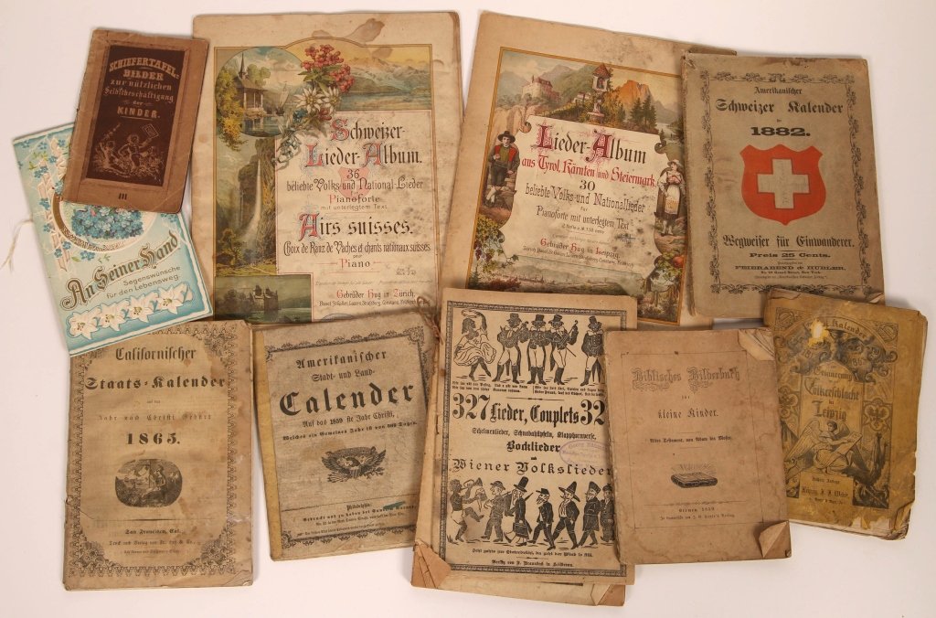 GERMAN-AMERICAN ALMANACS AND EPHEMERA 1859-1882: Lot includes a picture book, almanacs, poetry, bible stories and sheet music. We are happy to offer in-house shipping for all but very large or very fragile items. Some international orders may need t
