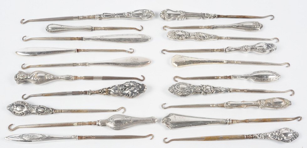 LARGE LOT OF STERLING HANDLED BUTTON HOOKS: Large lot of 20 antique button hooks with sterling handles, measure from 6.5 to 8.75 inches. This lot is not from the Mundwyler-Moulthrop estate. We are happy to offer in-house shipping for all but ve