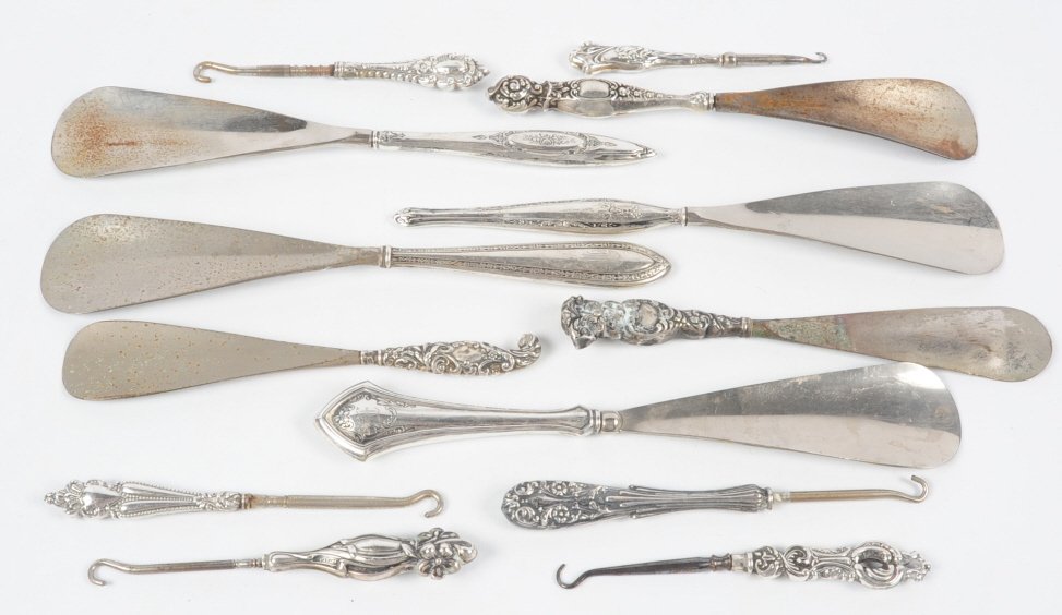LOT OF STERLING HANDLED BUTTON HOOKS AND SHOE HORNS: Lot of 13 antique button hooks and shoe horns with sterling handles, measure from 4 to 8.75 inches. This lot is not from the Mundwyler-Moulthrop estate. We are happy to offer in-house shipping for all
