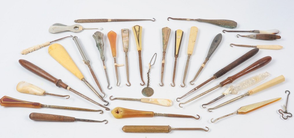 COLLECTION OF MORE THAN 300 ANTIQUE BUTTON HOOKS: More than 300 antique button hooks in a variety of materials including metal, wood and early plastics. This lot is not from the Mundwyler-Moulthrop estate. We are happy to offer in-house shipping for 