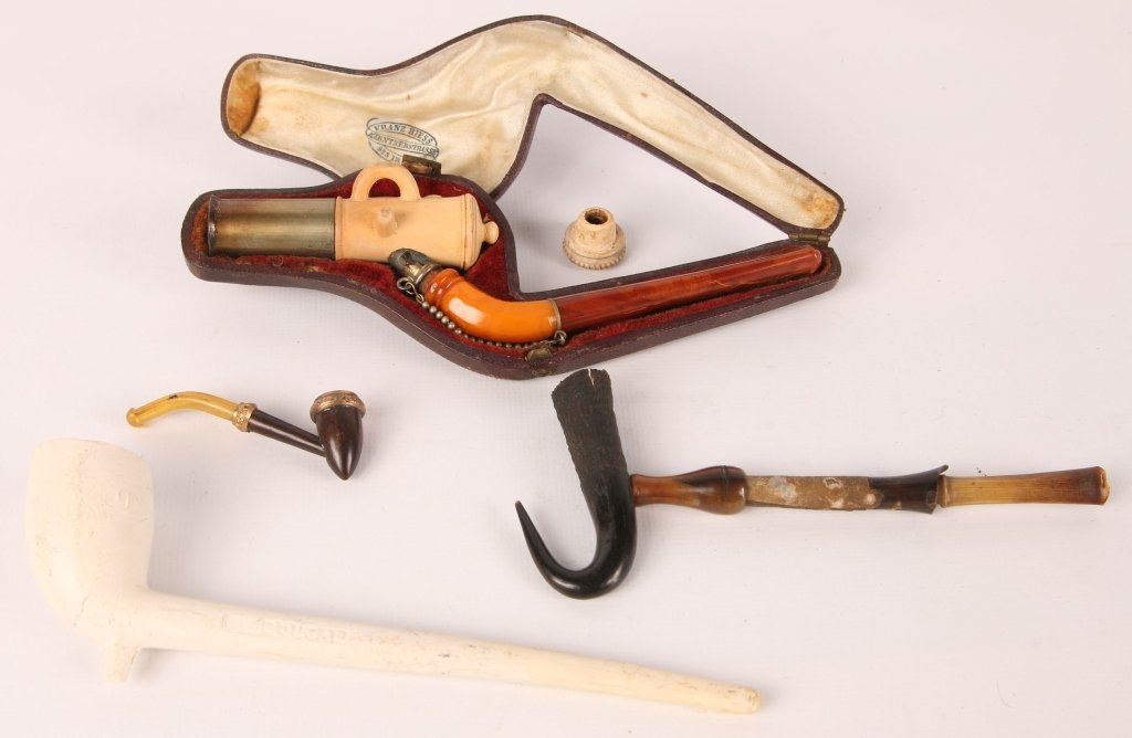 FRANZ HIESS FIGURAL CANNON MEERSCHAUM PIPE, OTHERS: Franz Hiess meerschaum figural cannon pipe or cigar holder, with original fitted case, measures 6 inches, good used condition noting some corrosion where the stem meets the bowl, hinged on the case is