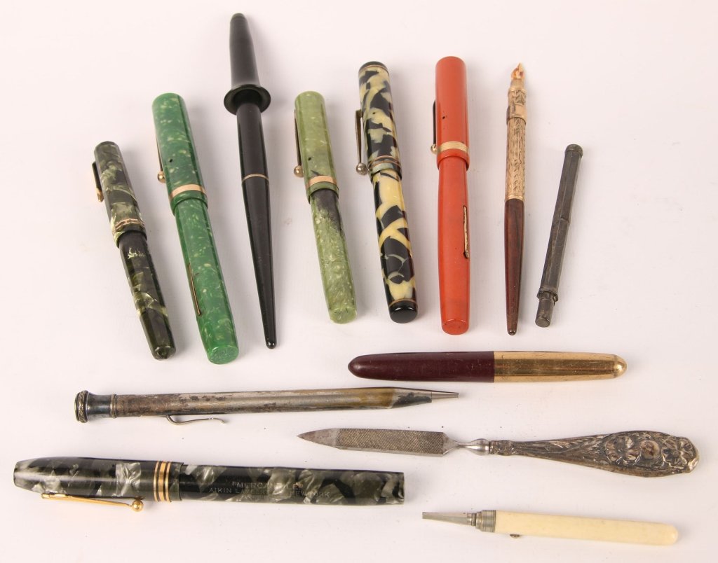 ANTIQUE FOUNTAIN PENS INCLUDING SHEAFFER: Lot includes: Waterman fountain pen with 14kt gold nib, yellow and black body, marked with and inlaid logo on the lid, marked 14kt on the nib, measures 5.25 inches; Sheaffer fountain pen with inlaid d