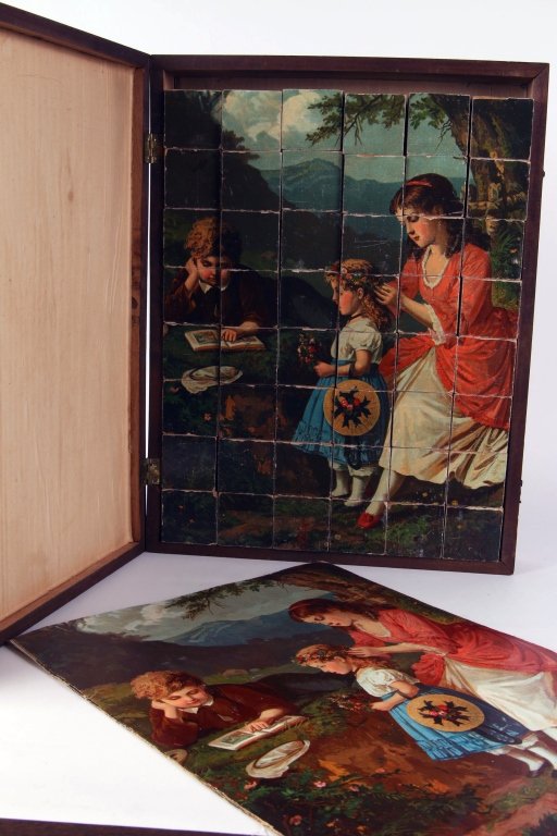 ANTIQUE LITHO ON WOOD PUZZLE IN BOX CREATES SIX SCENES: Six-sided cubes with printed pictures for six different puzzles, 42 blocks total, five full-size printed keys for the puzzles are mounted on linen with the sixth mounted on the lid, original wooden bo