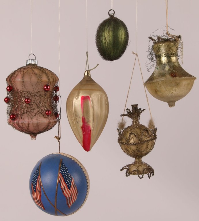 LOT OF VICTORIAN WIRE & TINSEL CHRISTMAS ORNAMENTS: Blown glass wire and tinsel ornaments, plus a German papier mâché ornament with American flags, measure 2.5 to 4 inches. We are happy to offer in-house shipping for all but very large or very fragil