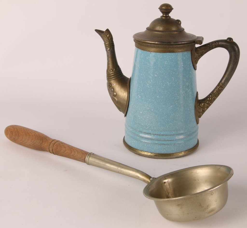 ENAMELED PEWTER COFFEE POT AND A LADLE: Coffee pot marked Manning Bowman Co., patent date is scratched out, measures 8 inches. Ladle is unmarked, wooden handle, measures 14.25 inches. We are happy to offer in-house shipping for all but very