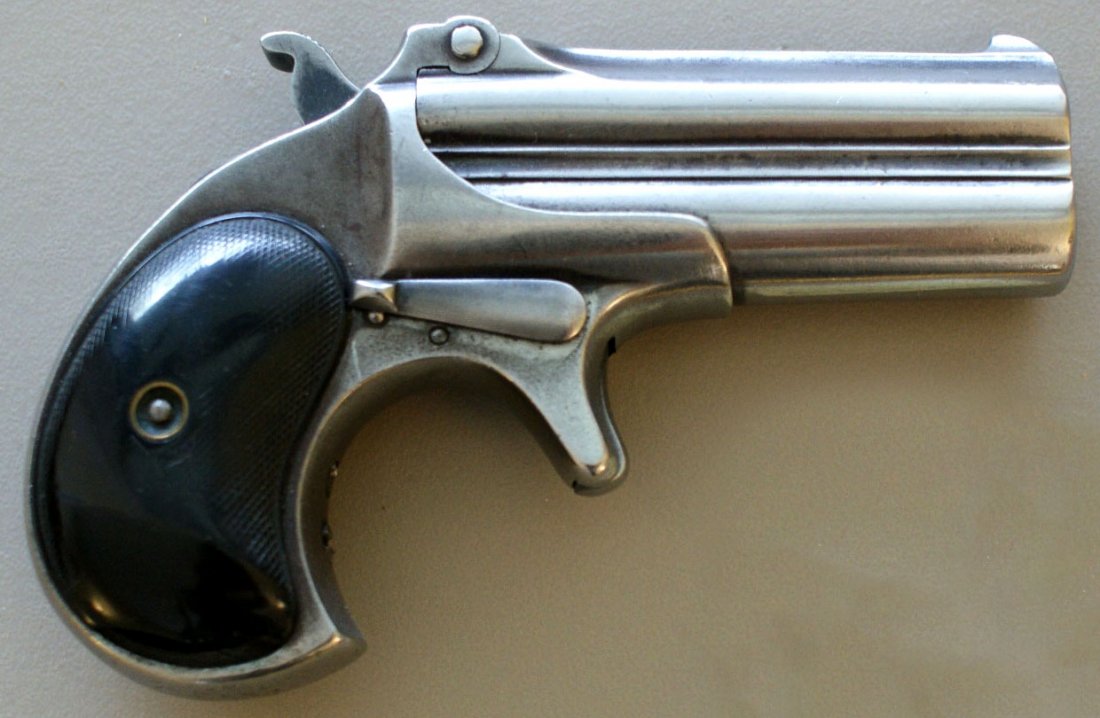 REMINGTON DOUBLE BARREL DERRINGER .41 CALIBER: Rim fire, #10, 4.75 inches overall, round butt, black plates. Provenance: Carlton Chester Moulthrop. See lot 168 for more items from C.C. Moulthrop. We are happy to offer in-house shipping for all but