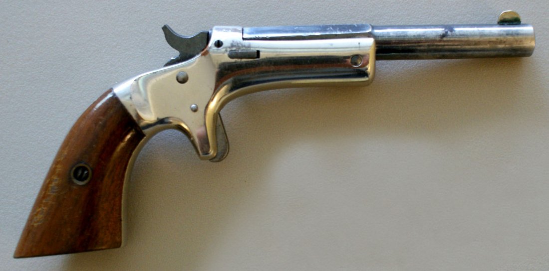 V. STEVENS DERRINGER SINGLE BARREL .22 CALIBER (?): Marked 7430 on the barrel, nickel frame, square butt, walnut plates. We are happy to offer in-house shipping for all but very large or very fragile items. Some international orders may need to be hand