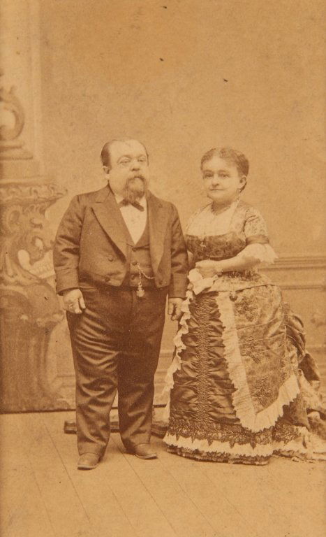 LOT OF EARLY 20TH CENTURY PHOTOGRAPHY: Including a photogravure of cat on doll sized Eastlake bed with catnip hanging on the footboard and a Christmas stocking on the headboard with a Christmas tree in the background, circa 1905. The image