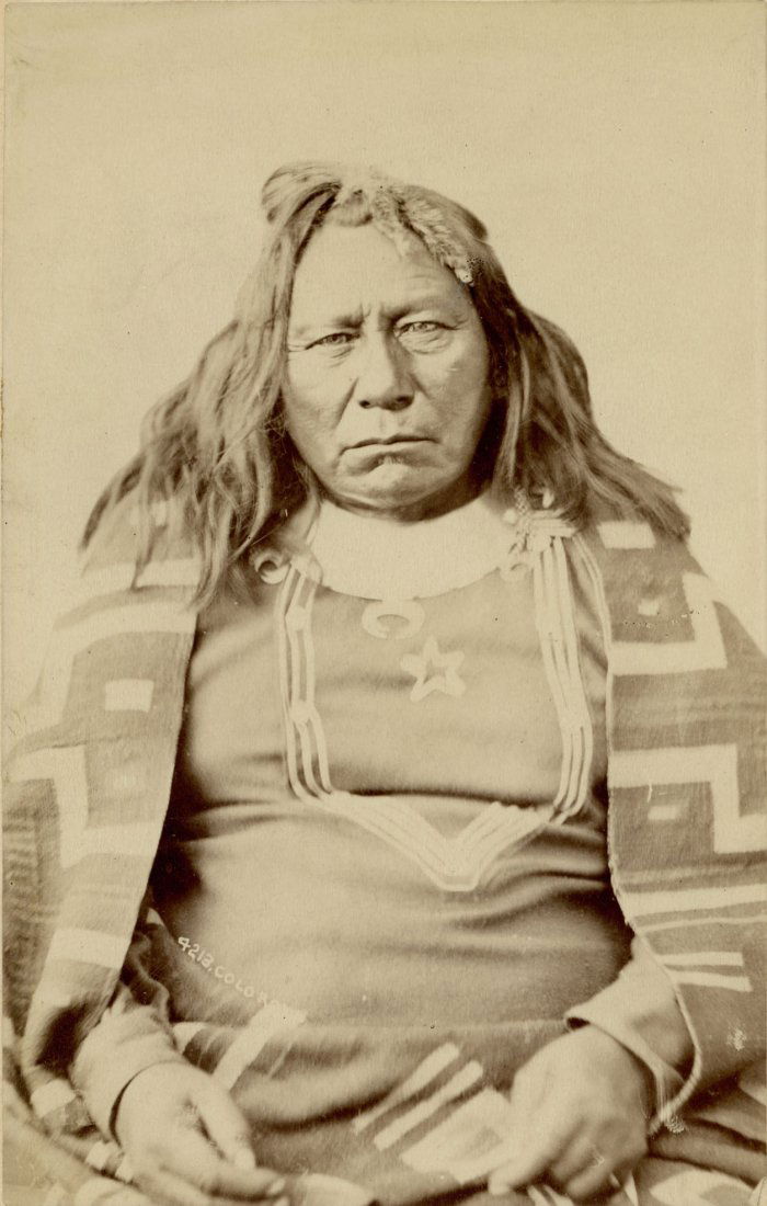 W.H. JACKSON ALBUMEN PORTRAIT UTE CHIEF COLOROW: William Henry Jackson (1843-1942) mounted albumen photograph of Ute Indian Chief Colorow (Circa 1810-1888). Circa 1880 cabinet card numbered 4213 on the negative and thus the image titled Colorow near