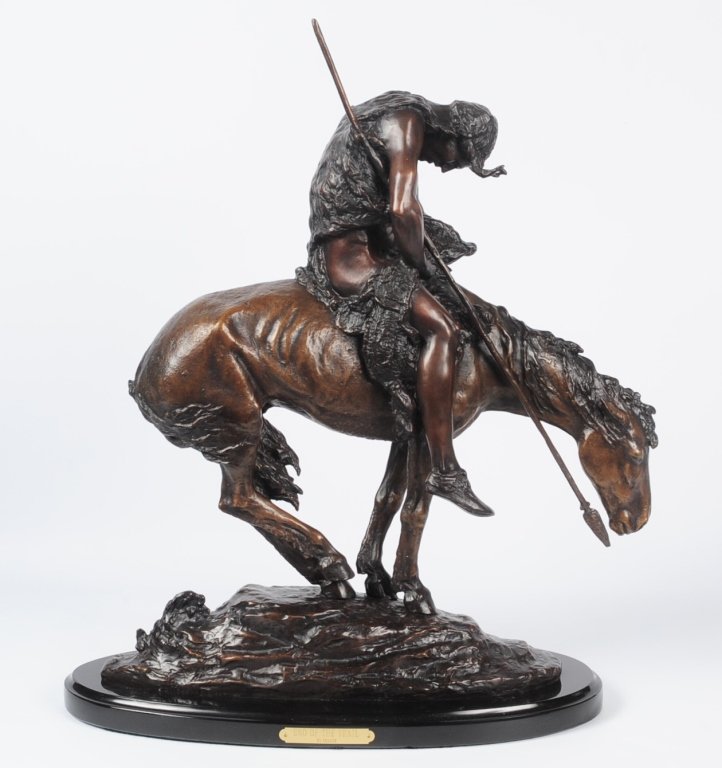 JAMES FRASER (1876-1953) REPRODUCTION BRONZE: Titled 'End of the Trail' with a brass plaque on the marble base, signed J.E. Fraser and numbered 68/775, measures 23 x 19 inches. We are happy to offer in-house shipping for all but very large or ver