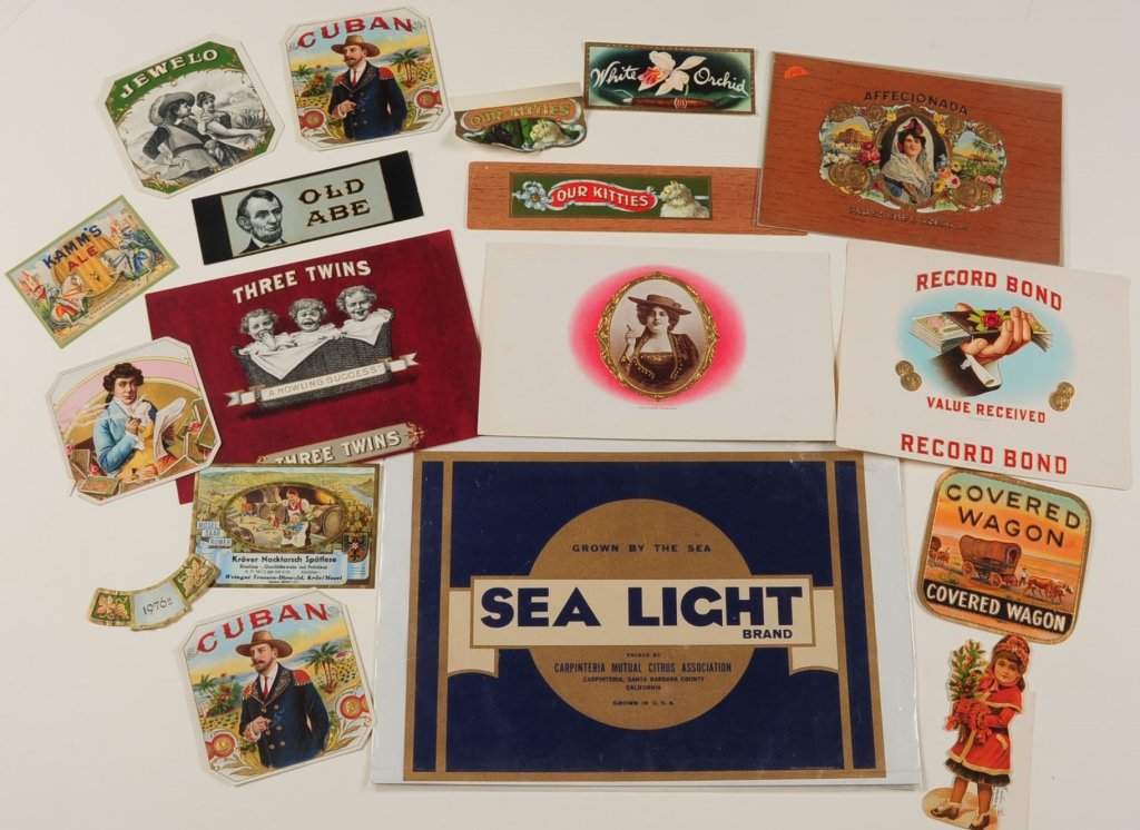 COLLECTION OF CIGAR BOX AND CRATE LABELS: Twenty-four pieces, three framed and three mounted on boards, the rest are loose, measure from 5.5 x 2.25 to 17 x 17 inches. Provenance: The Estate of Kansas Artist David Melby. We are happy to offer